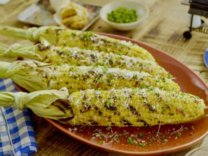 Beauty shot of Molly Yeh's Grilled Corn with Spicy Calabrian Chili Butter as seen on Girl Meets Farm, Season 11.