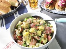 Tangy, a little smoky, and herbaceous, this mayo-free potato salad is great for serving with hot dogs, hamburgers, or any of your favorite cookout treats. And because I believe everything's better with bacon, you'll find that in here, too!