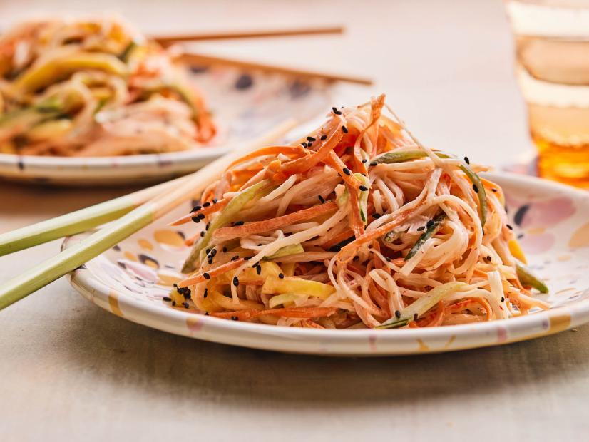 Description: Food Network Kitchen's Kani Salad. Keywords: Imitation Crab, Carrots, Cucumbers, Mango, Japanese Mayonnaise, Rice Vinegar, Sriracha.