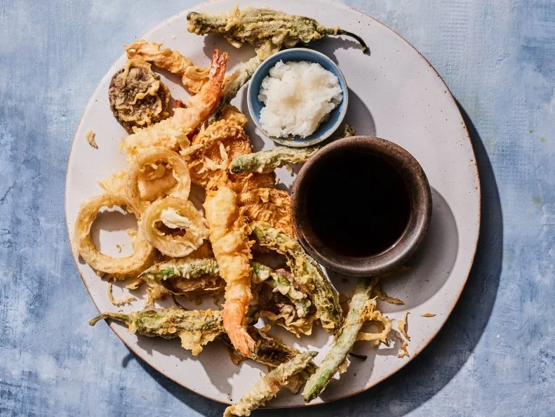Description: Food Network Kitchen's Shrimp and Vegetable Tempura. Keywords: Dashi, Mirin, Soy Sauce, Daikon Radish, Shrimp, Green Beans, Shiitake Mushrooms, Shishito Peppers, Onion, Cake Flour, Egg, Cornstarch.