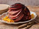 Description: Food Network Kitchen's The Best Ham Glaze. Keywords: Ham, Soy Sauce, Maple Syrup, Dijon Mustard, Orange, Apple Cider Vinegar, Cinnamon, Cloves.