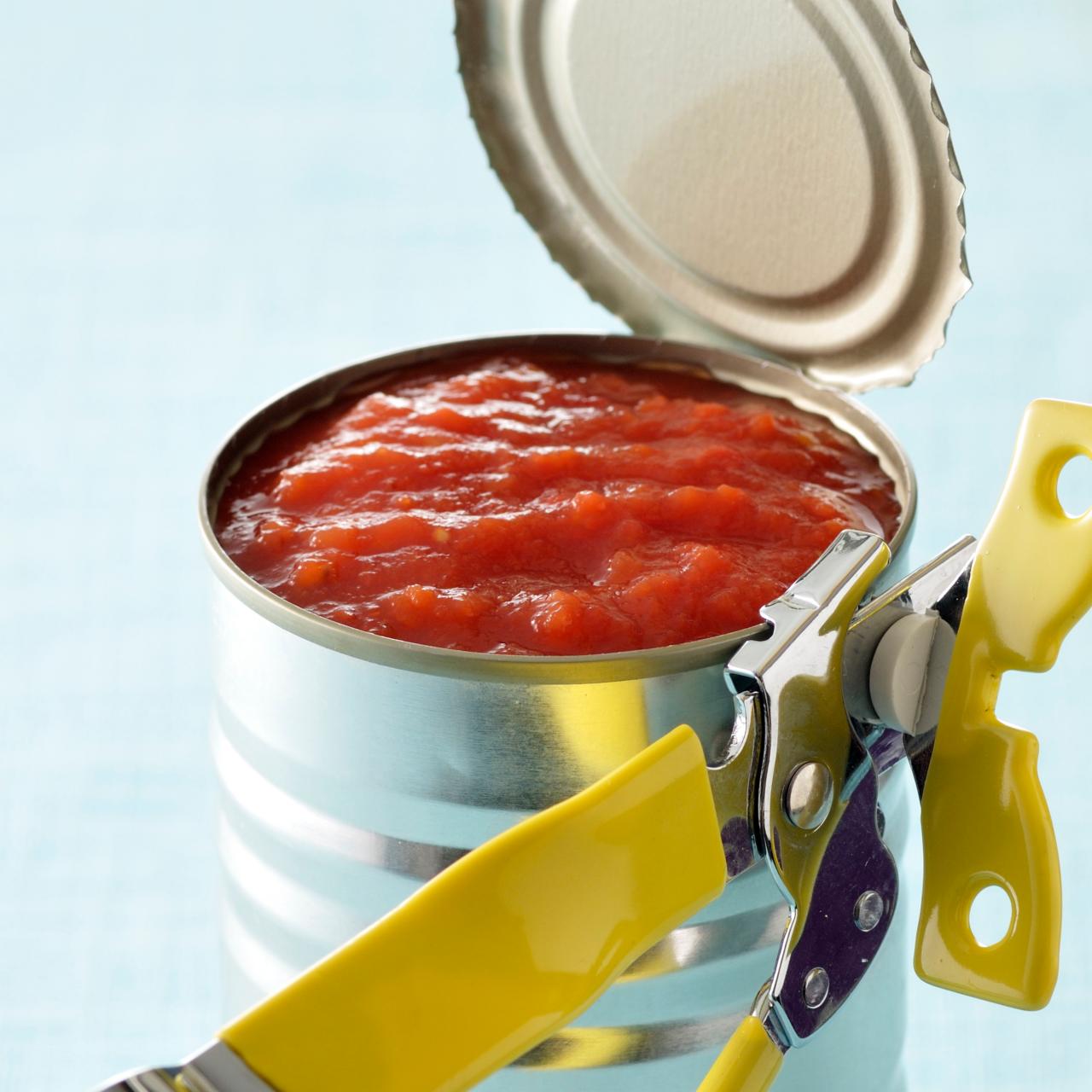 https://food.fnr.sndimg.com/content/dam/images/food/fullset/2022/08/31/yellow-can-opener-opening-can-of-tomatoes.jpg.rend.hgtvcom.1280.1280.suffix/1661929106558.jpeg