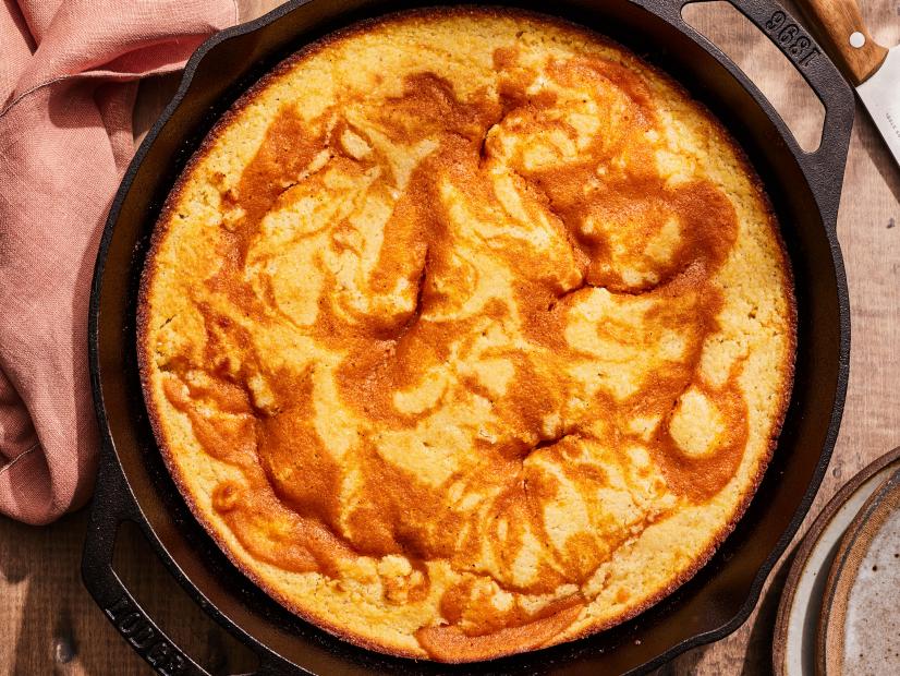 Description: Kardea Brown's Sweet Potato Pie-Stuffed Cornbread. Keywords: Sweet Potato, Orange Juice, Cinnamon, Nutmeg, Vanilla Extract, Egg, Cornmeal, Buttermilk.