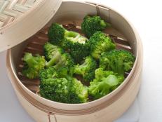Brocolli florets steamed in a bamboo steamer.