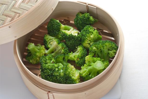 Brocolli florets steamed in a bamboo steamer.