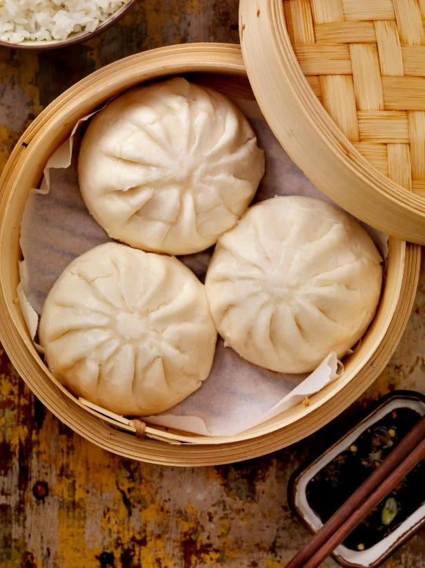 Steamed Pork Bun in a bamboo steamer with soya sauce and rice -Photographed on Hasselblad H1-22mb Camera