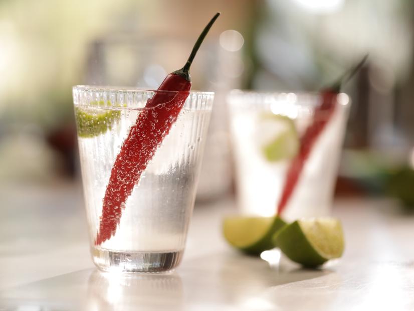 Landscape, close-up of chilli cocktails, limes in background, as seen on Mary McCartney Serves It Up, season 3.