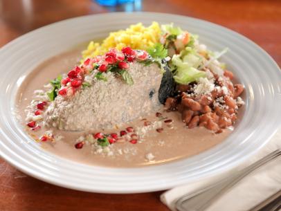 The Chile Relleno En Nogada as served at Antonio's: The Taste of Mexico in Taos, New Mexico, as seen on Diners, Drive-Ins and Dives, season 36.