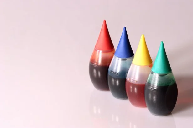 Four bottles of food coloring.