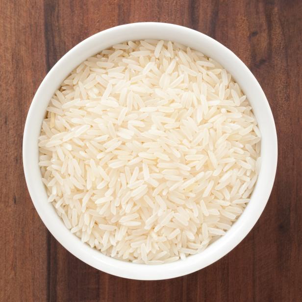 Top view of white bowl full of jasmine rice