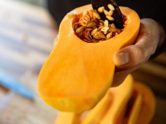 Food preparation, scrape out the seeds of a pumpkin with a spoon