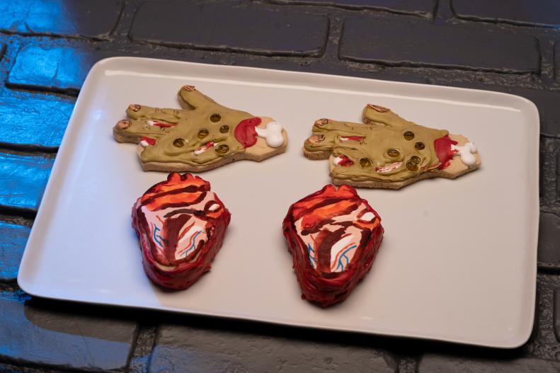 Contestant Stephen Horner's round 1 dish, Heart and Zombie, Vanilla Almond Sugar cookie with vanilla almond Royal Icing, as seen on Halloween Cookie Challenge, Season 1.