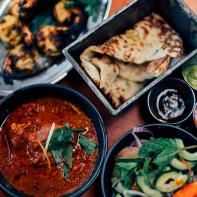 Butter chicken curry, grilled prawns and nan bread.