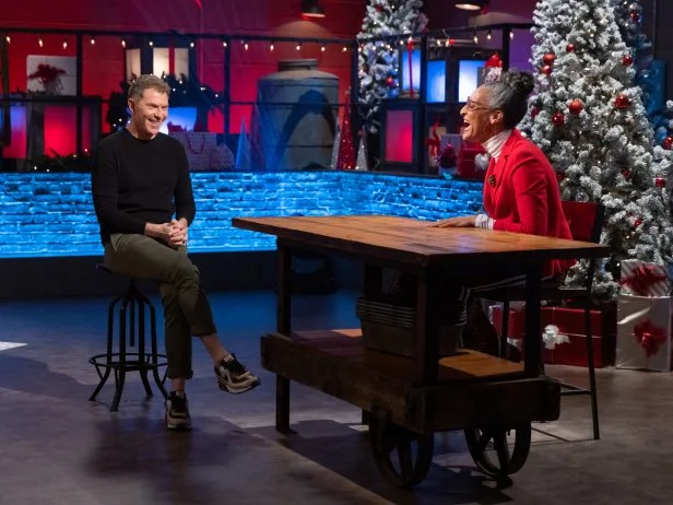 Chef Bobby Flay laughs with co-host Carla Hall before Round 1, as seen on Beat Bobby Flay: Holiday Throwdown.
