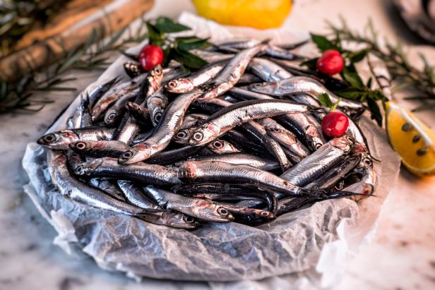 fresh anchovies, presented on flat before being cooked with chilli and lemon
