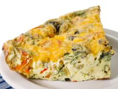 Breakfast vegetable and cheese egg frittata on white background