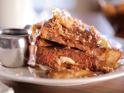 The Bananas Foster French Toast as served at Nutmeg Bakery & Café in San Diego, California, as seen on Diners, Drive-Ins and Dives, season 36.