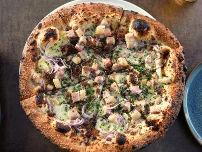 The Pork Belly Pizza as served at Roof 106 in Healdsburg, California, as seen on Diners, Drive-Ins and Dives, season 36.