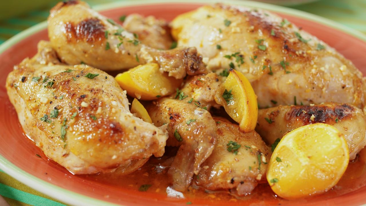 https://food.fnr.sndimg.com/content/dam/images/food/fullset/2022/12/19/KC3213-katie-lee-biegel-lemon-garlic-chicken_s4x3.jpg.rend.hgtvcom.1280.720.suffix/1671496800903.jpeg