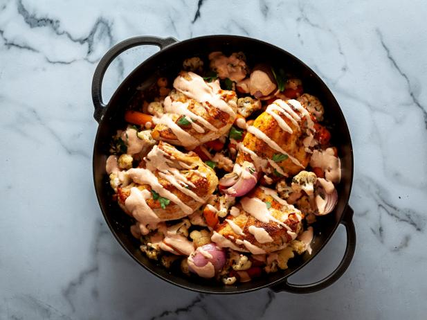 https://food.fnr.sndimg.com/content/dam/images/food/fullset/2022/12/19/WU3302-ree-drummond-chicken-cauliflower-skillet_s4x3.jpg.rend.hgtvcom.616.462.suffix/1671496796974.jpeg