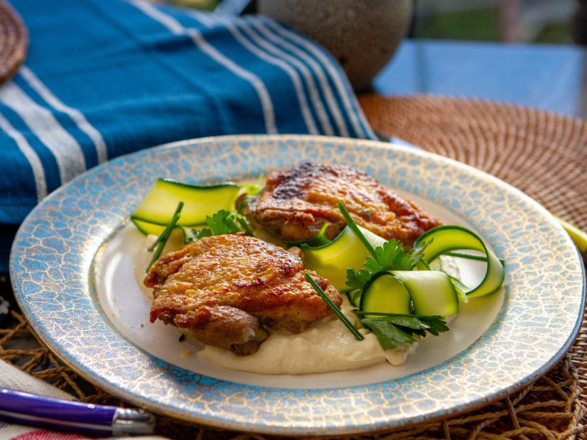Antonia Lofaso's Roasted Chicken Thighs with Garlic Puree and Shaved Zucchini Salad, as seen on Guy’s Ranch Kitchen Season 6.