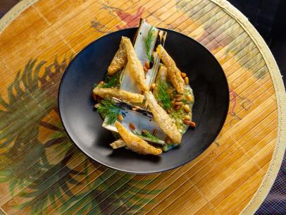 Eric Adjepong’s Fried Anchovies with Charred Leeks and Anchovy Dressing, as seen on Guy’s Ranch Kitchen Season 6.