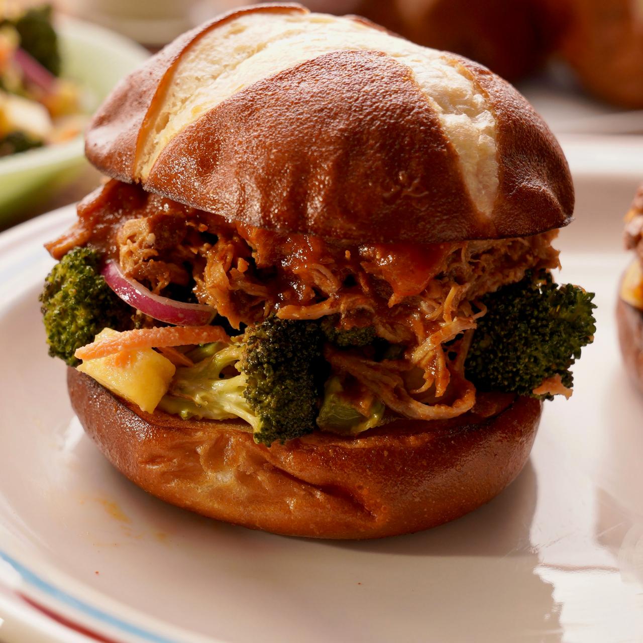 https://food.fnr.sndimg.com/content/dam/images/food/fullset/2022/12/21/MW1203-molly-yeh-pulled-pork-sandwiches-with-charred-broccoli-salad_s4x3.jpg.rend.hgtvcom.1280.1280.suffix/1671640481656.jpeg