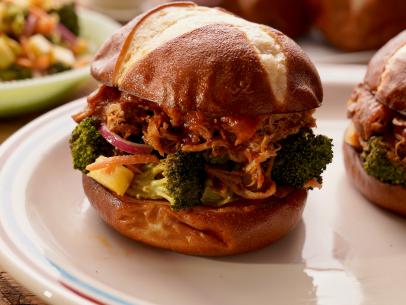 Beauty shot of Molly Yeh's Pulled Pork Sandwiches with Charred Broccoli Salad, as seen on Girl Meets Farm Season 12.