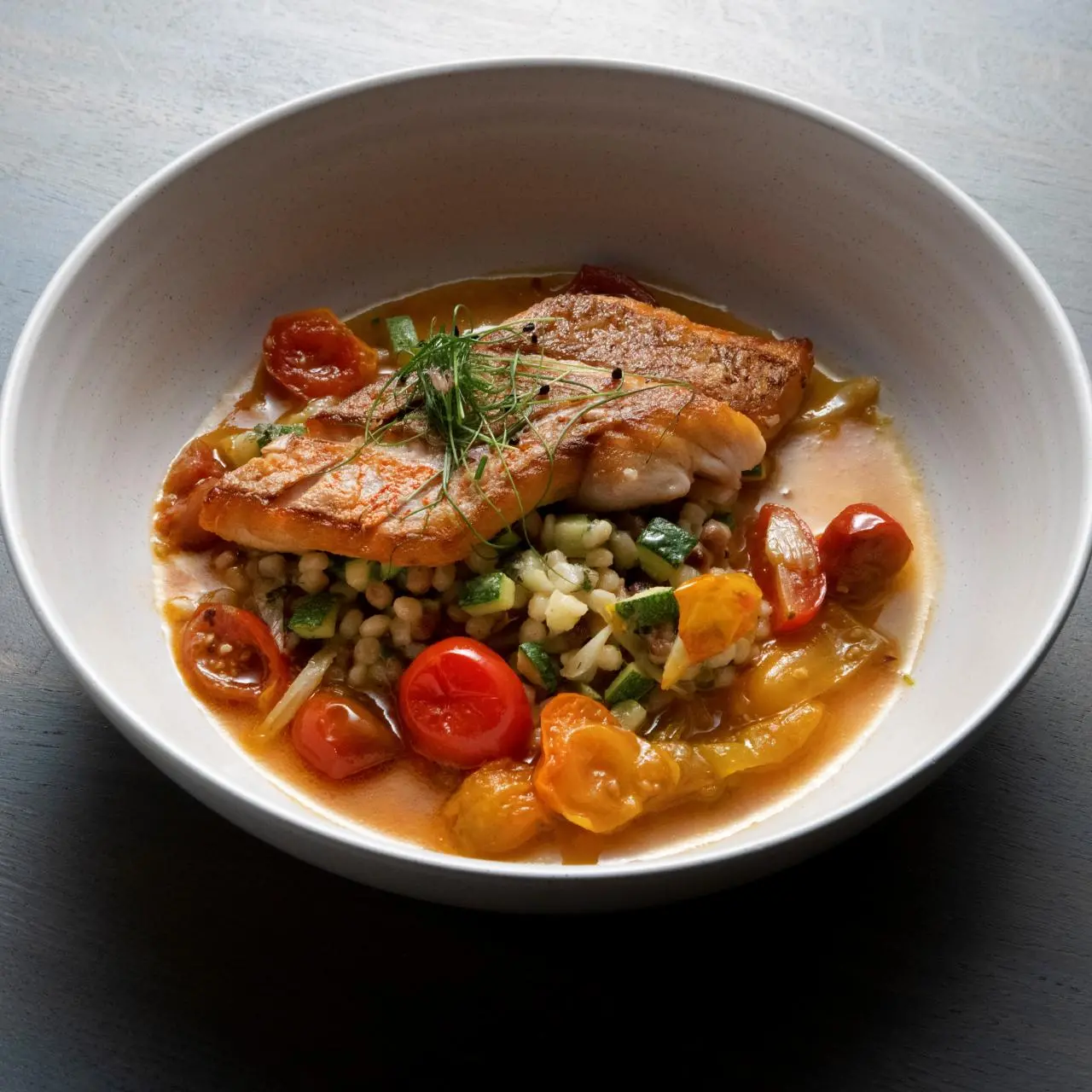 Seared Red Snapper with a Burst Cherry Tomato Sauce with Fregola