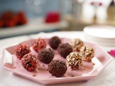 Yes. It is perfectly natural to want to have a chocolate party. I like to prepare one type of chocolate truffle filling and roll it in a few different coatings to make them more unusual. You can make a box of these as gifts, or you can be honest and keep them all for yourself and your family! It&rsquo;s hard to give these away once you dig in. I have offered my suggested toppings, but you can play with the flavors and make your own fun. You can also assemble the chocolate base with double the vanilla and no rum if alcohol is something you want to avoid. Don&rsquo;t like salt in your chocolate? Simply omit it.