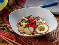 This recipe is inspired by Hawaii-style saimin, a dashi-based noodle soup with a clear broth. Here, soba are swapped for the wheat and egg saimin noodles that give the soup its name.