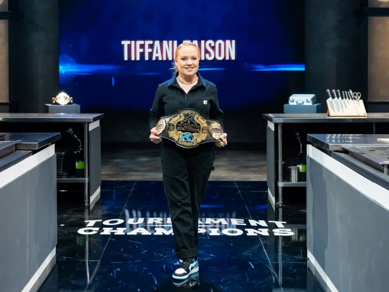 Contestant Tiffani Faison with the 2022 Tournament of Champions Belt, as seen on Tournament of Champions, Season 4.