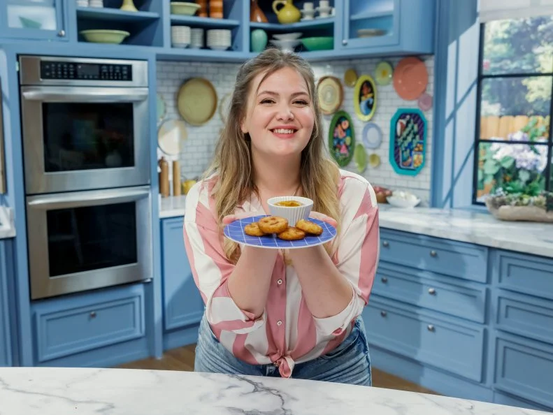 Poppy O'Toole poses with her Potato Smileys, as seen on The Kitchen, Season 34.