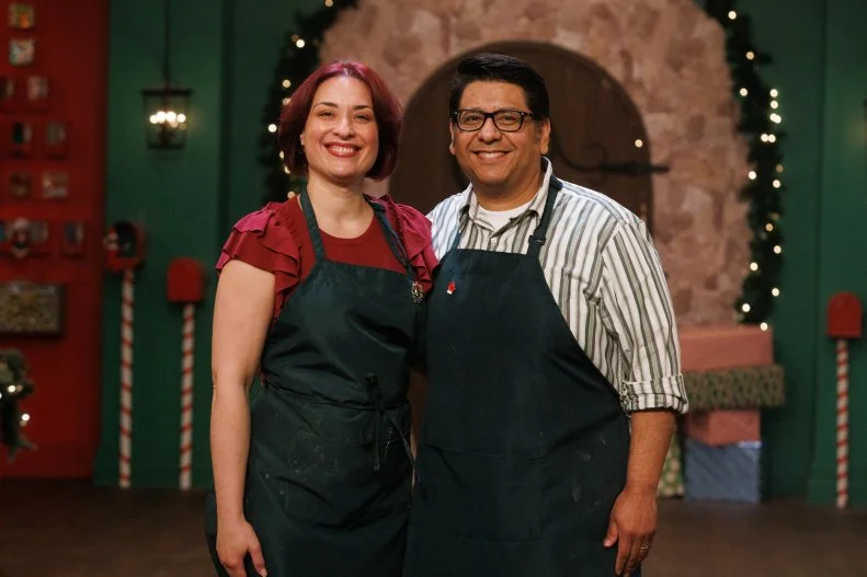 Sweet makers Tatiana Kovalenko and Andy De La Cruz pose together, as seen on The Elf on the Shelf: Sweet Showdown, Season 1.