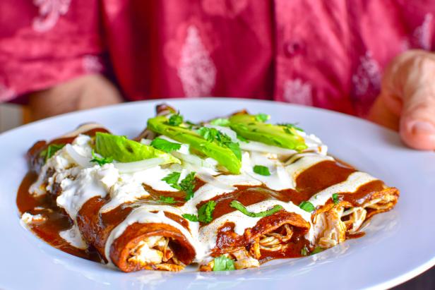 Delicious enchiladas of great Mexican food, mole and cheese,typical mexican food.