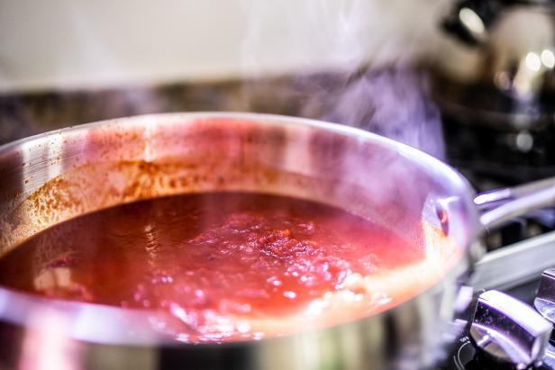 Close-up of tomato sauce being cooked on a saucepan at home