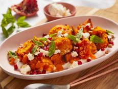Slowly roast juicy and hearty squash with pine nuts and feta.