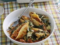 I love a baked pasta dish, and this one is a favorite of mine. Jumbo pasta shells are stuffed with a creamy collard green mixture and meaty tomato gravy, sprinkled with cheese and then baked up to bubbly perfection. It's great as a one-dish meal!