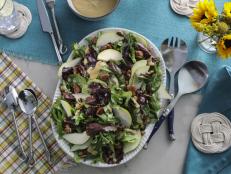 The caramelized Vidalia onion vinaigrette is what makes this simple salad super special. After I caramelize the onions, I blend them up with the rest of the vinaigrette ingredients in a food processor. The result is a thick, creamy, sweet and tangy dressing that pairs perfectly with pears and glazed pecans. Feel free to add a crumbly cheese, too, if you'd like.