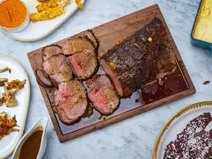 Host Selena Gomez and Chef Alex Guarnascelli's dish "Black Pepper Roast Beef and Gravy", as seen on Selena + Chef: Home for the Holidays, Season 5.