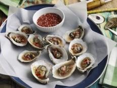 If it's an "R" month here in Charleston, that is, a month that has an "R" in it (think December, January, etc.), you can guarantee that there will be an oyster roast going on somewhere in town. At a traditional oyster roast, everyone stands around a fire pit and a big table (often covered in newspaper) and shucks just-steamed oysters. Here, in addition to our traditional method, I show you how to roast the oysters in the oven and how to make a delicious mignonette to serve with them.
