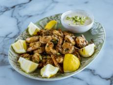 Ree has reinvented the shrimp cocktail for her party entertaining. Normally, shrimp cocktails are served cold with a ketchup based cocktail sauce. This Cajun version is served hot and the sauce is creamy. Ree likes to prepare this dish in front of her guests while chatting over a glass of wine.