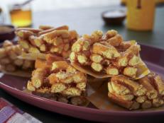 When Molly first learned about these Chinese treats in high school, she was instantly hooked. She describes them as skinny little donuts that are held together with sugar syrup and compressed into bar form&hellip;kind of like an airier, less sweet crispy rice treat that you can eat a ton of since they&rsquo;re addictively good. This is her honey version.