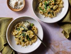 This super-flavorful pasta recipe gives you a satisfying meal in just 20 minutes and with just a handful of ingredients. Orecchiette and broccoli rabe is a popular combination from Italy’s Puglia region. Our version takes inspiration from the rustic approach there and concentrates on just a handful of ingredients like garlic, red pepper and anchovies so the broccoli rabe (rapini in Italian) takes the spotlight. Boiling it right in with the pasta makes this Italian favorite less bitter and particularly tender, plus it eliminates the step of cooking it separately. You can serve it topped with Parmesan if you like, but it’s plenty flavorful without.