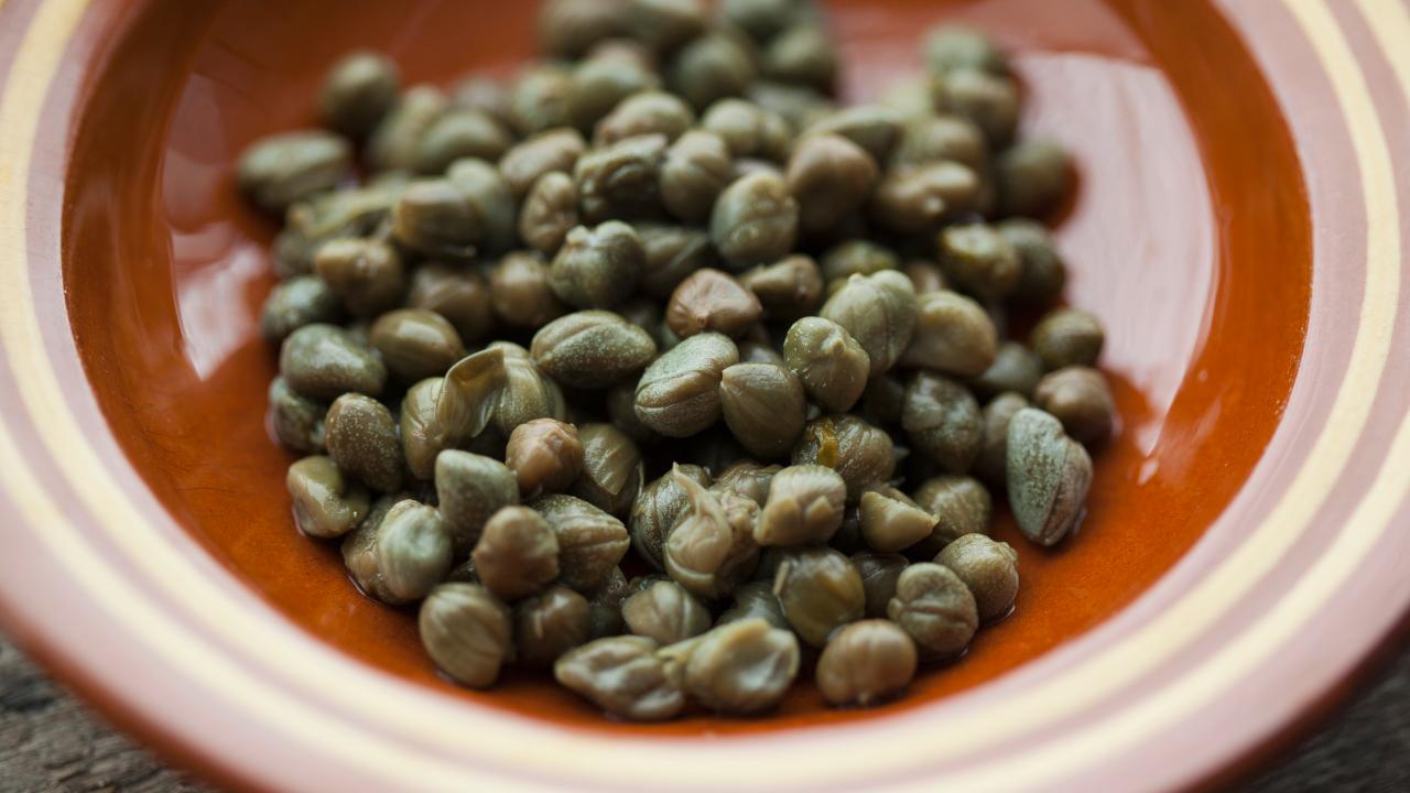 https://food.fnr.sndimg.com/content/dam/images/food/fullset/2023/19/capers-brown-bowl.jpg.rend.hgtvcom.1280.720.suffix/1703021985372.jpeg