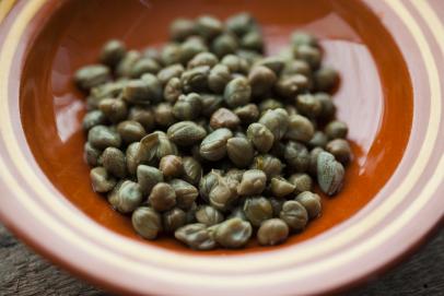 https://food.fnr.sndimg.com/content/dam/images/food/fullset/2023/19/capers-brown-bowl.jpg.rend.hgtvcom.406.271.suffix/1703021985372.jpeg