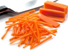 Cutting carrots into julienne sticks.  Focus on middle carrot sticks.  More fruits and vegetables: