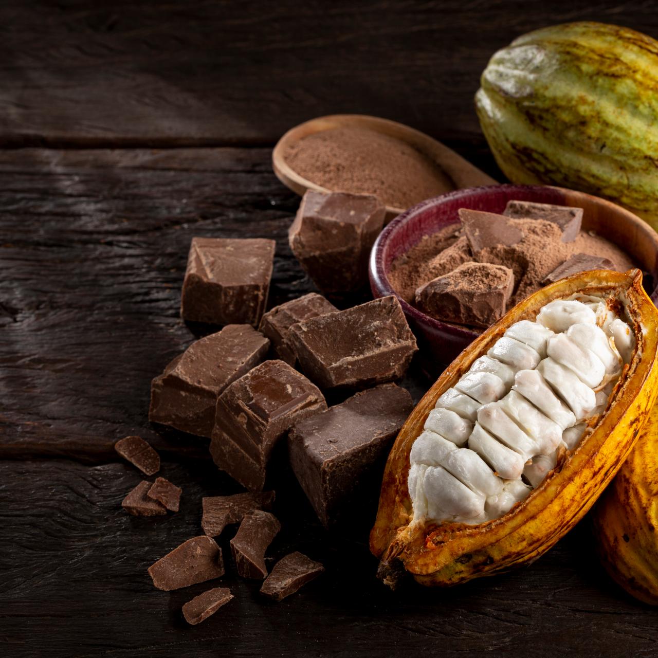 https://food.fnr.sndimg.com/content/dam/images/food/fullset/2023/2/16/cacao-pod-split-open-and%20whole-with-chocolate-and-chocolate-powder-on-wood-background.jpg.rend.hgtvcom.1280.1280.suffix/1676555197113.jpeg