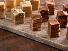 Six Different Flavors of Fudge on a Wooden Table