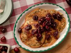 Wild rice grows like crazy in Minnesota, so Molly is always looking for ways to add it to recipes. It has a heartier texture but adds a really nice nuttiness when folded into light, fluffy pancake batter, and the cherry compote adds the perfect amount of tartness.